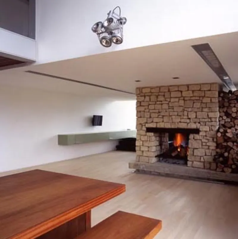 Fireplace at Bedford modern barn conversion, K235 (photo 3)