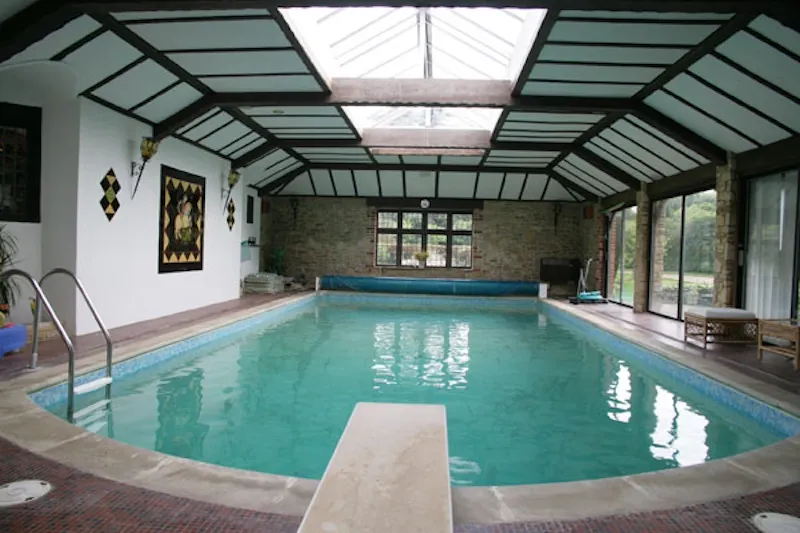 Swimming pool - indoor at Surrey Hills listed manor house, M68 (photo 26)