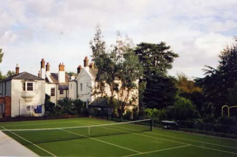 Tennis court at Beautiful old rectory in Shere, B1319 (photo 4)