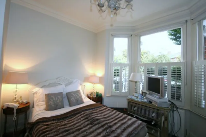 Bedroom at Pretty Parsons Green garden flat, F976 (photo 8)