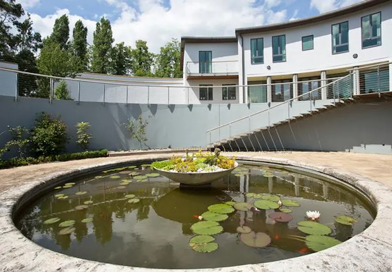 Pond at Intriguing curved Hampton house, D2109 (photo 48)