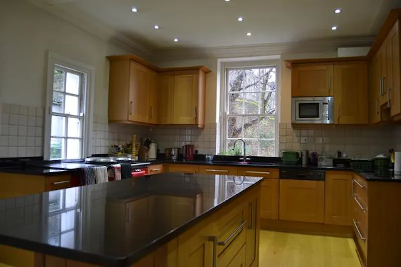 Kitchen island at White stucco Greenwich house, A1302 (photo 7)