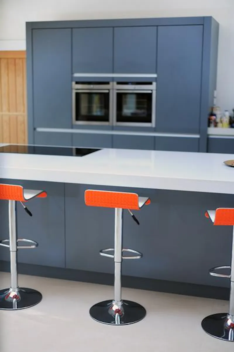 Kitchen island at Colourful & modern Falmouth home, K383 (photo 8)
