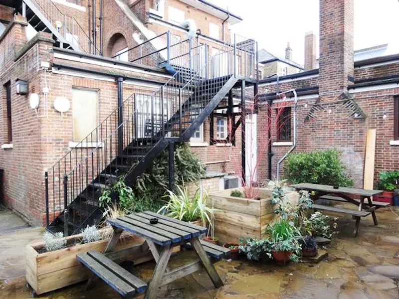 Garden at Peckham panelled pub with stage, R781 (photo 31)