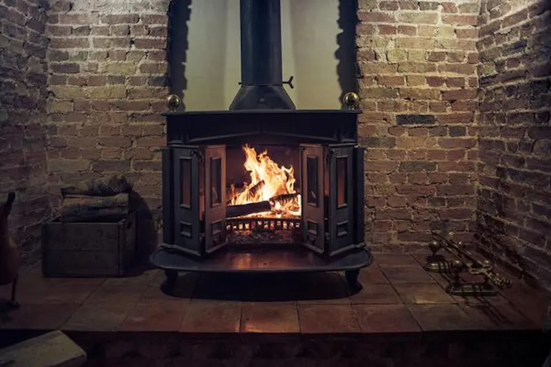 Fireplace at Stylish dark Ely farmhouse, L653 (photo 4)