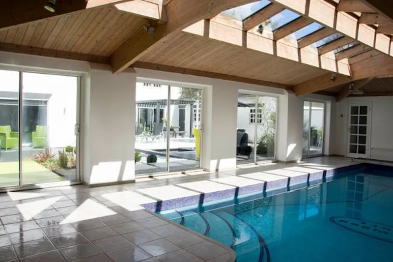 Swimming pool - indoor at Virginia Water modern mansion, D2245 (photo 17)