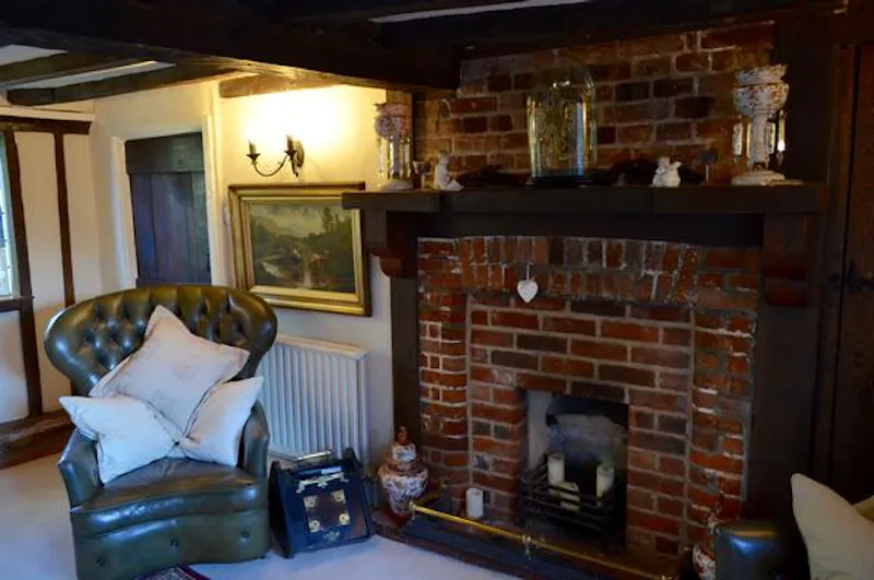 Fireplace at Quaint thatched Essex cottage, M297 (photo 6)