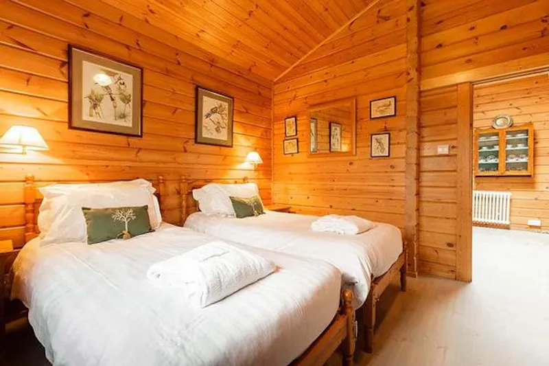 Bedroom at Kemble lakeside cabin, Q124 (photo 11)
