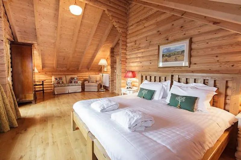 Bedroom at Kemble lakeside cabin, Q124 (photo 36)