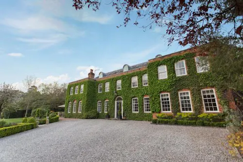 Ivy covered home in Windlesham, A1478