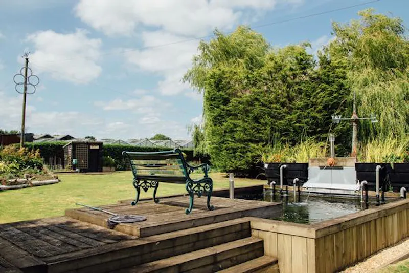 Pond at Large timber-clad detached Herts home, D2416 (photo 12)