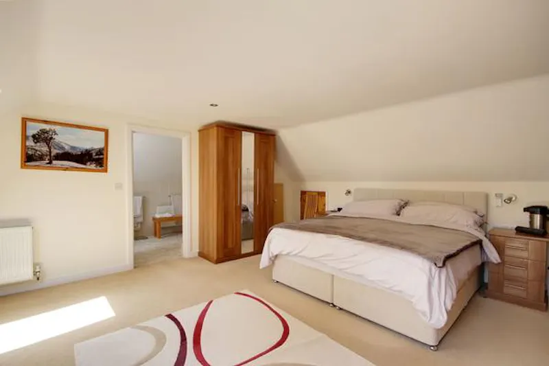 Bedroom at South Downs L-shaped bungalow, D2417 (photo 17)