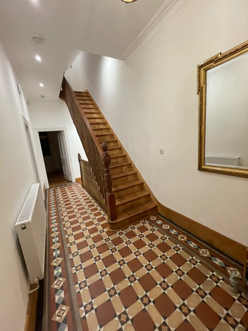 Entrance hall at Barons Court family home, B1983 (photo 3)