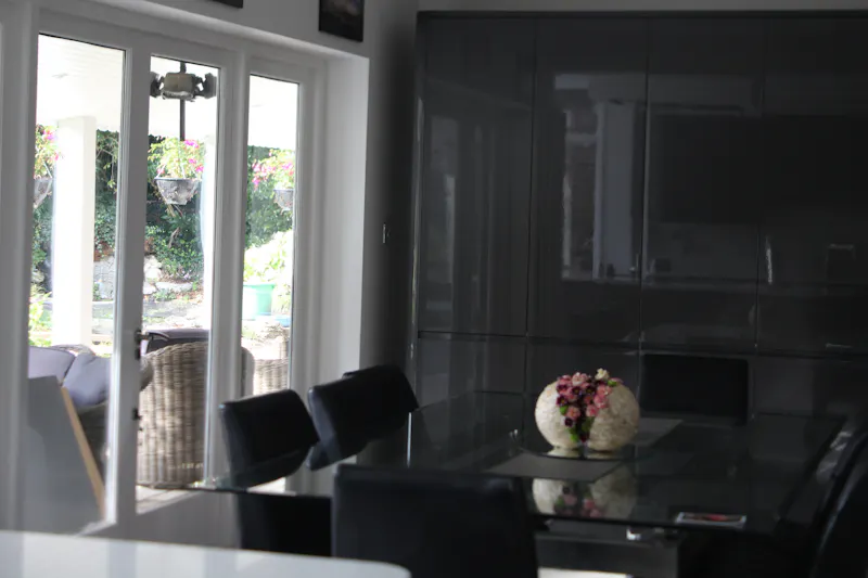 Dining room at Modern home in Bush Hill, D2620 (photo 8)