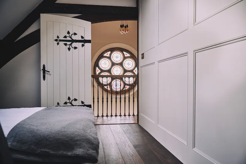 Bedroom at Leeming converted church, B2015 (photo 22)