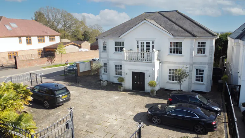 Chigwell white stucco home, D2727 (photo 1)
