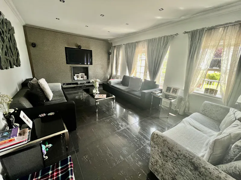 Living Room at Chigwell white stucco home, D2727 (photo 14)