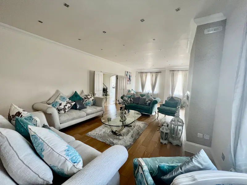 Living Room at Chigwell white stucco home, D2727 (photo 5)