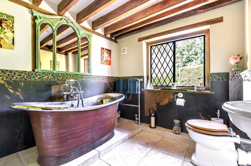 Bath - rolltop at Picturesque Woking cottage, C939 (photo 23)