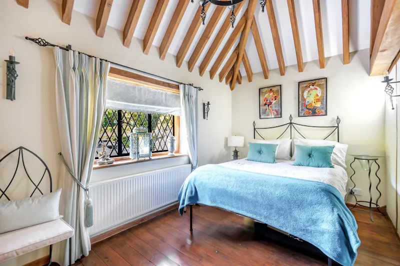 Bedroom at Picturesque Woking cottage, C939 (photo 19)