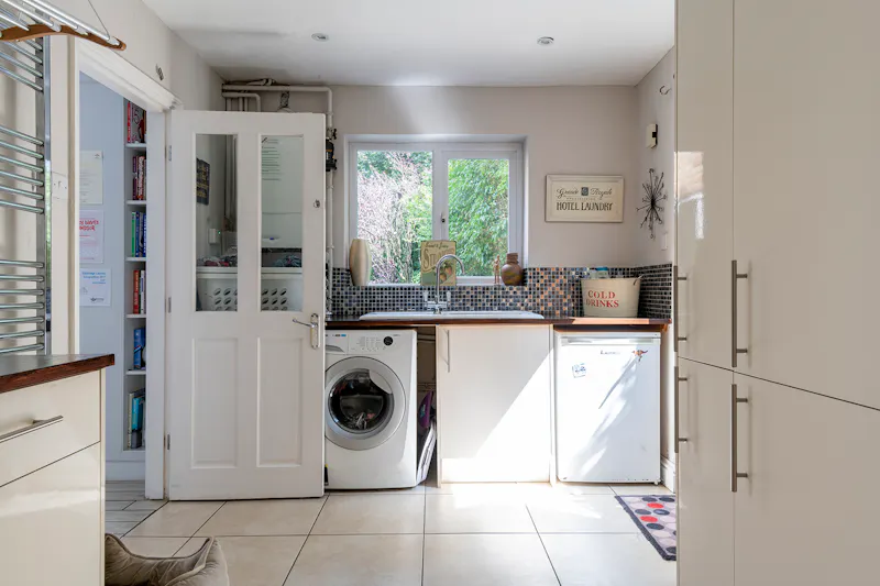 Utility room at Classic Mock-Tudor House Esher, D2782 (photo 9)