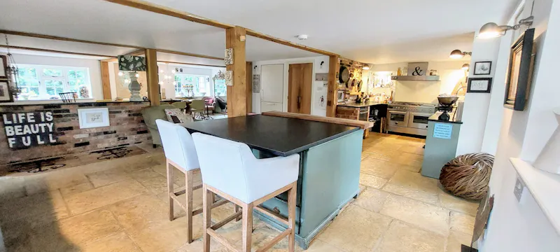 Kitchen island at Homely Farmhouse Hampshire, L760 (photo 11)