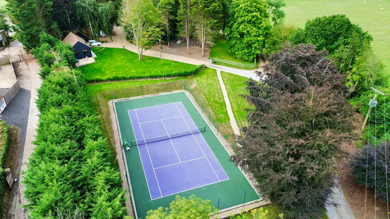 Tennis court at Grade II Dallington Farmhouse, A1662 (photo 43)