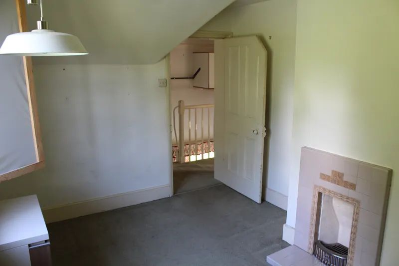 Fireplace at Ellastone Groundskeeper Cottage, A1669 (photo 16)