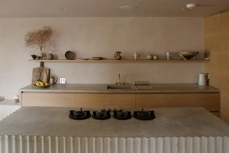 Kitchen island at Minimal Townhouse in Hackney , B2112 (photo 12)