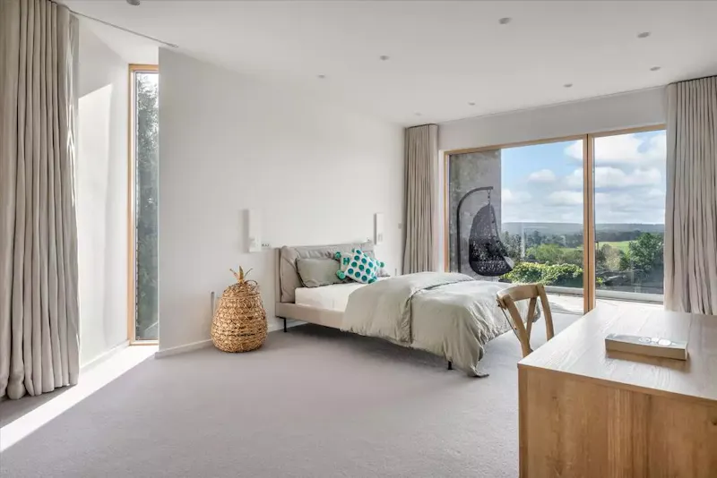 Bedroom at Modern hillside house Frensham, K517 (photo 15)